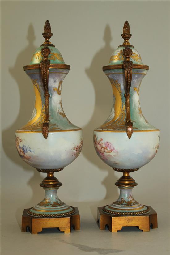 A pair of Sevres style porcelain and ormolu mounted vases and covers, late 19th / early 20th century, 31cm, one cover chipped